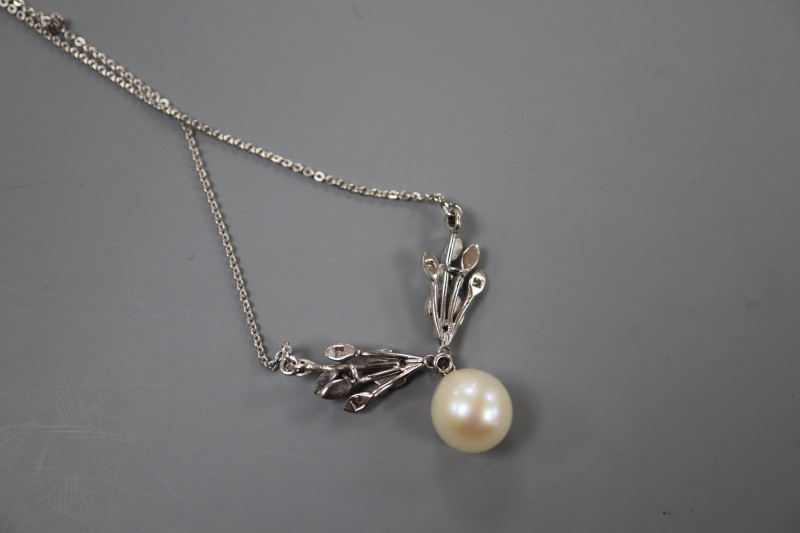 A modern white metal, cultured pearl, diamond and blue enamel set drop pendant necklace, pendant 31mm, chain 37cm, gross 6.3 grams.